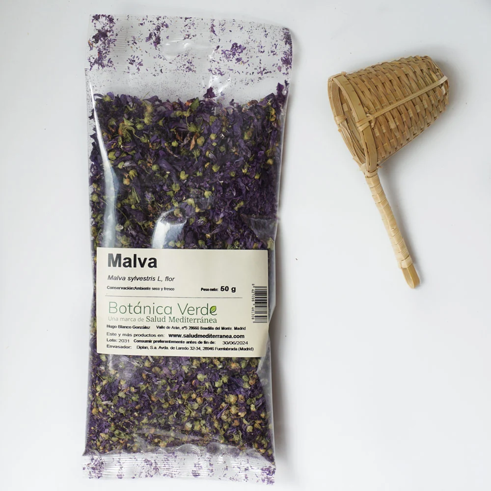 Maceta de Autorriego con Reserva Malva en flor. Planta en bolsa - 50 gr. Botánica Verde