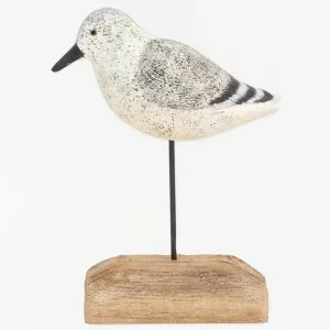 Pájaro de madera en tonos blancos, negros y grises