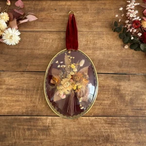 Decorativo Premium Composition florale sous verre bombé fond violine ruban bordeaux